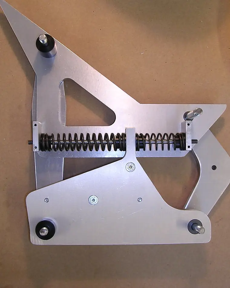 CNC machined aluminium stilt part with its sprung rocking mechanism