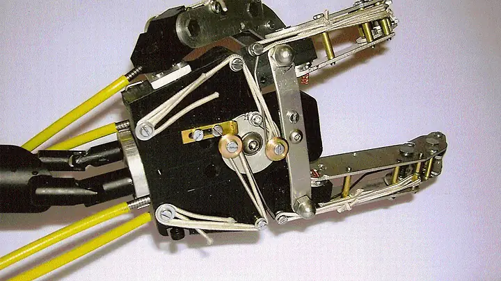 Vogon arm mechanism with cables, pulleys and aluminium fingers on a white background